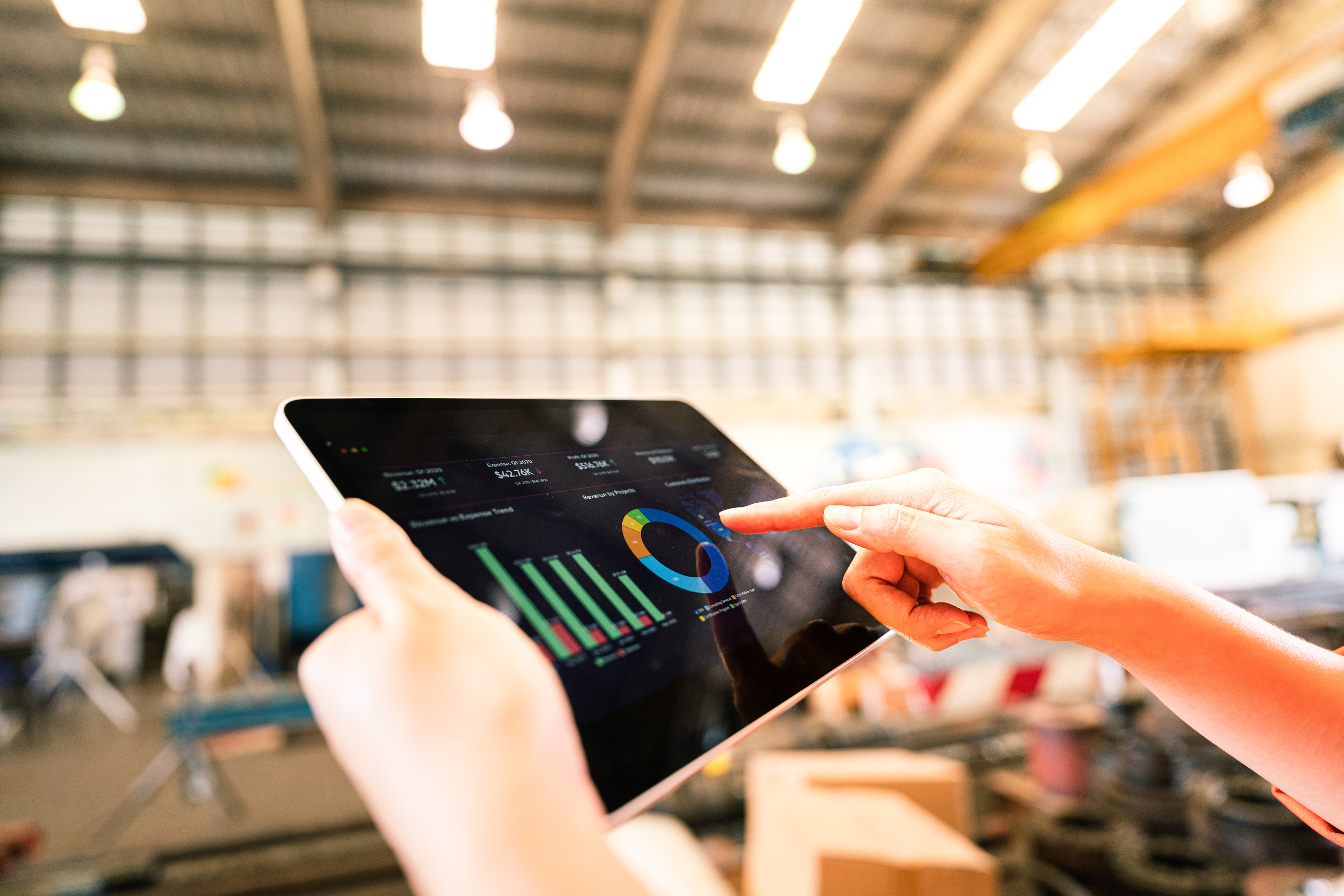 Inventory management being conducted in a warehouse from an iPad.